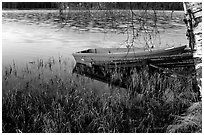 Red boat on a lakeshore. Central Sweden (black and white)
