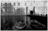 Boat and moat of Vadstena slott. Gotaland, Sweden (black and white)
