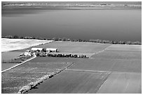 Fields bordering lake Vattern near Granna. Gotaland, Sweden (black and white)