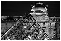 Pyramid and Louvre at night. Paris, France (black and white)