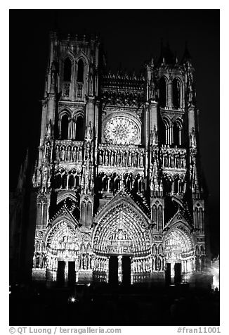 Cathedral facade laser-illuminated at night to recreate original colors, Amiens. France