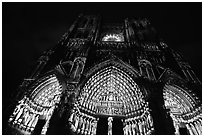 Looking up cathedral with doors laser-illuminated to recreate original colors, Amiens. France ( black and white)
