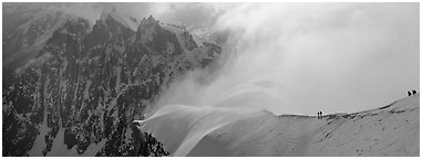 Ridge with alpinists and high peaks. France (Panoramic black and white)