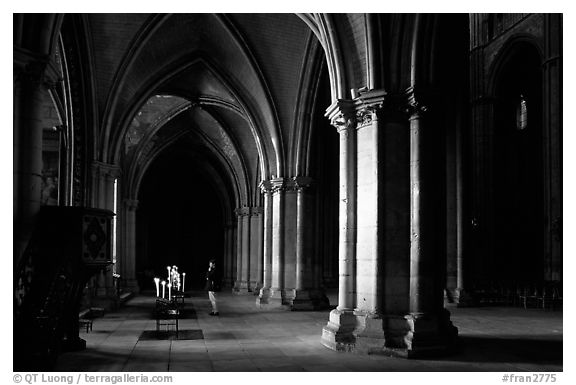 Worshiper inside the Saint-Etienne Cathedral. Bourges, Berry, France (black and white)