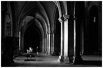 Worshiper inside the Saint-Etienne Cathedral. Bourges, Berry, France ( black and white)