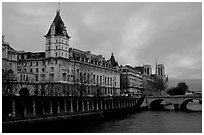 Conciergerie, Pont-au-change, and Ile de la Cite at sunset. Paris, France (black and white)