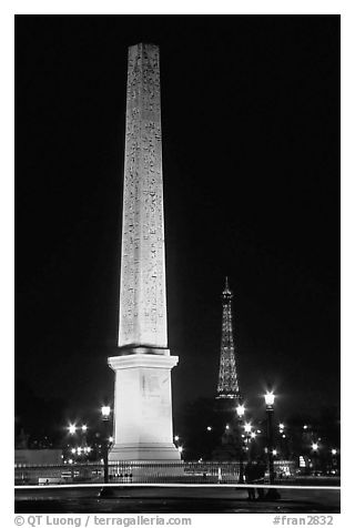 Luxor obelisk of the Concorde plaza and Eiffel Tower at night. Paris, France