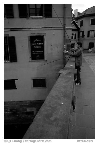 Fishing in a canal. Strasbourg, Alsace, France (black and white)