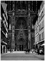 Facade of the Notre Dame cathedral seen from nearby street. Strasbourg, Alsace, France ( black and white)