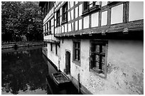 Half-timbered houses next to a canal. Strasbourg, Alsace, France (black and white)
