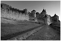 Path leading to old walled city. Carcassonne, France (black and white)