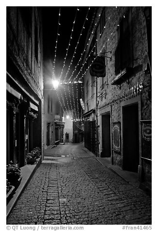 Medieval street by night with Christmas decorations and. Carcassonne, France