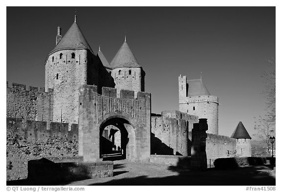 Main entrance of fortified city and drawbridge. Carcassonne, France (black and white)