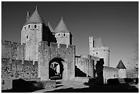 Main entrance of fortified city and drawbridge. Carcassonne, France (black and white)