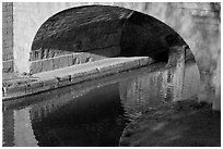 Stone bridge across Canal du Midi. Carcassonne, France (black and white)