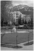 Public garden and snowy mountains. Grenoble, France ( black and white)