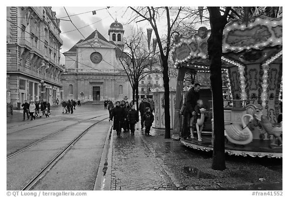 Street carousel and church. Grenoble, France (black and white)