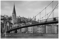Suspension brige on the Saone River and St-George church. Lyon, France ( black and white)