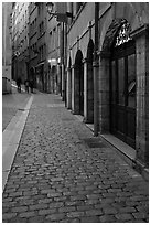 Cobblestone pavement on historic distric street. Lyon, France ( black and white)