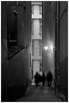 Silhouettes in staircase on Fourviere Hill at dusk. Lyon, France ( black and white)