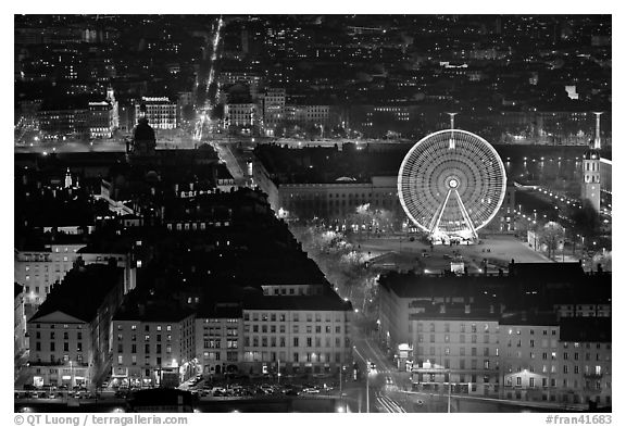 Bellecour square with Ferris wheel at night, seen from above. Lyon, France (black and white)