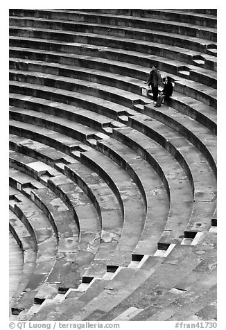 Couple standing in amphitheater, Orange. Provence, France (black and white)