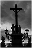 Cross and statues with sunset clouds. Avignon, Provence, France ( black and white)