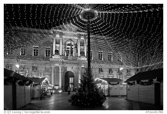 Christmas fair and City hall at night. Avignon, Provence, France (black and white)