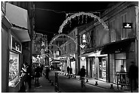 Commercial street at night. Avignon, Provence, France ( black and white)