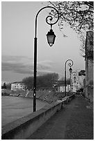Walkway on the banks of the Rhone River at dusk. Arles, Provence, France (black and white)