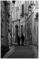 Couple walking in old street. Arles, Provence, France ( black and white)