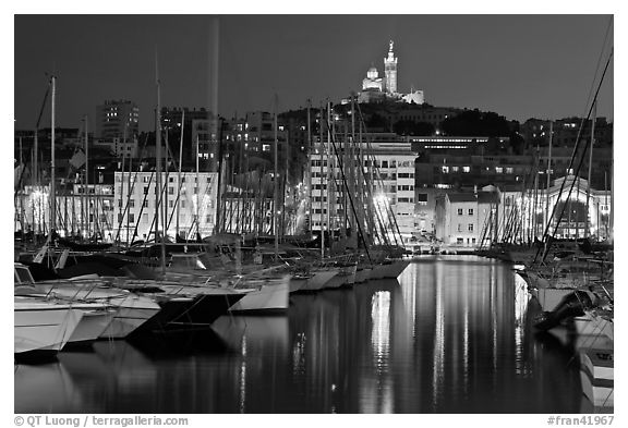 Harbor and Notre Dame de la Garde Basilic on hill. Marseille, France