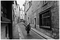 Boy walking in narrow street, Chartres. France ( black and white)