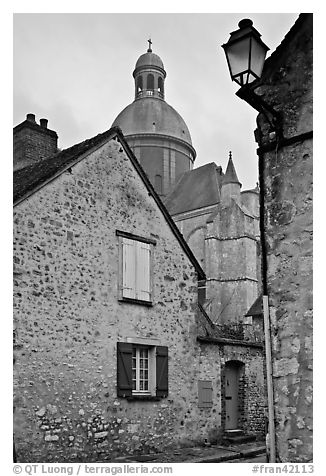 Stone houses and dome of Saint Quiriace Collegiate Church, Provins. France (black and white)