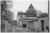 Street with couple walking and Caesar's Tower in background, Provins. France ( black and white)