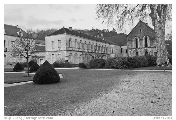 Lawn and forge in winter, Abbaye de Fontenay. Burgundy, France (black and white)