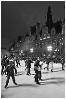 Holiday skaters, Hotel de Ville by night. Paris, France (black and white)