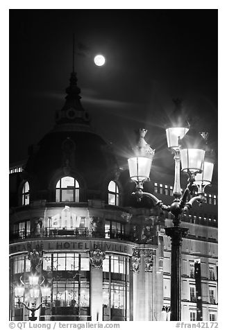 Street lamps, BHV department store, and moon. Paris, France (black and white)