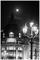 Street lamps, BHV department store, and moon. Paris, France (black and white)