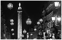 Christmas lights and Place Vendome column by night. Paris, France ( black and white)