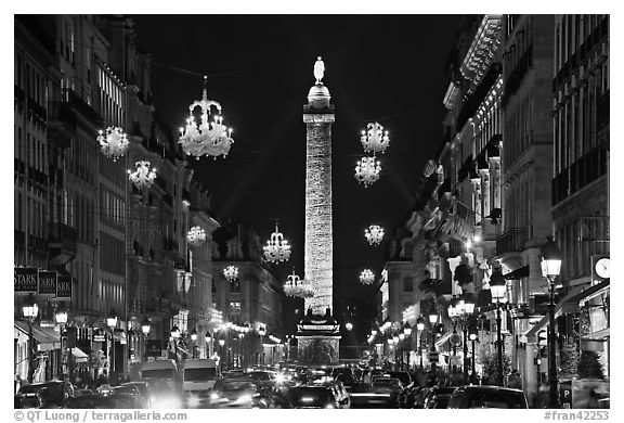 Street with lights and Place Vendome column. Paris, France (black and white)