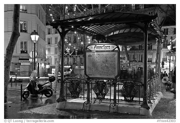 Subway entrance with art deco canopy by night. Paris, France (black and white)