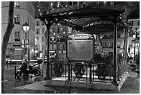 Subway entrance with art deco canopy by night. Paris, France ( black and white)