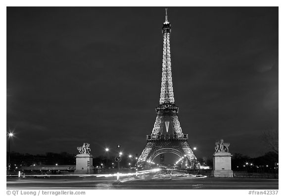 Eiffel Tower seen across Iena Bridge at night. Paris, France (black and white)
