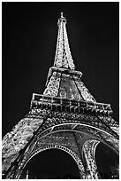 Illuminated  Eiffel Tower seen from close. Paris, France ( black and white)