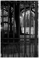 Cluny thermes behind iron grids by night. Quartier Latin, Paris, France (black and white)