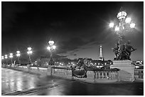 Lamps on Pont Alexandre III by night. Paris, France (black and white)