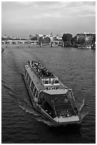 Bateau-mouche (tour boat) on Seine River. Paris, France ( black and white)