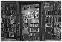 Books on shelves seen through storefront. Quartier Latin, Paris, France ( black and white)