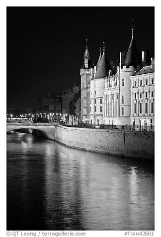 Conciergerie reflected in Seine river at night. Paris, France (black and white)